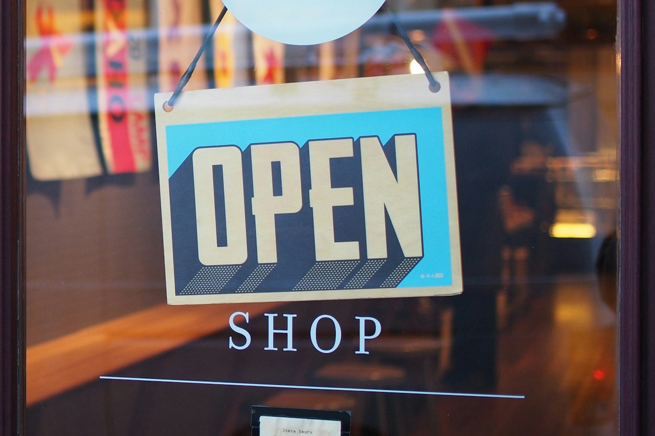 A small shop front with an open sign, like the original Tophillsport.com sports gear store